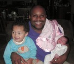 Uncle Omar with nephew Nicholas (2 years) and Akilah (1 week)