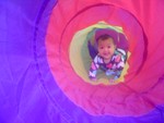 Akilah explores the tent tunnel (6 months)