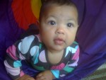 Akilah explores the tent tunnel (6 months)