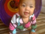 Akilah explores the tent tunnel (6 months)