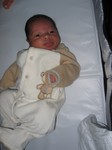 Looking at Mommy before he gets changed