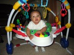 Nicholas in his bouncer playing