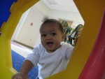 Nicholas climbing and playing