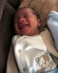 Nicholas smiling in his sleep