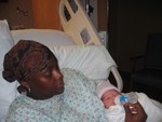 New Momma and Nicholas with his first bottle