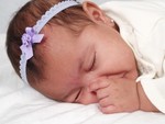 Akilah sucking her thumb - 3 months