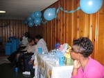 The guests watch as more presents are opened