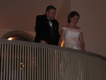 The couple looking down at the crowd